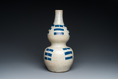 A Chinese blue and white crackle-glazed double gourd 'trigrams' vase, probably  Ming