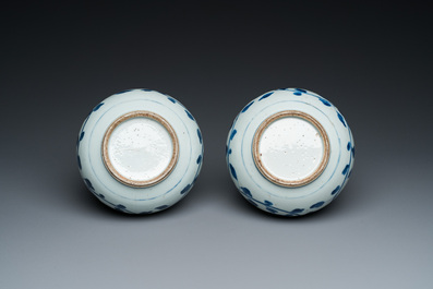 A pair of Chinese blue and white 'peony scroll' pharmacy bottles, Kangxi