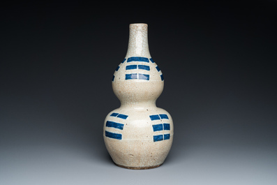 A Chinese blue and white crackle-glazed double gourd 'trigrams' vase, probably  Ming