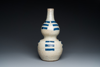 A Chinese blue and white crackle-glazed double gourd 'trigrams' vase, probably  Ming