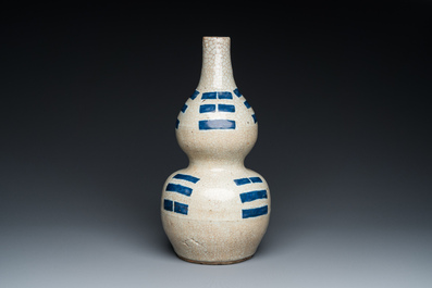 A Chinese blue and white crackle-glazed double gourd 'trigrams' vase, probably  Ming