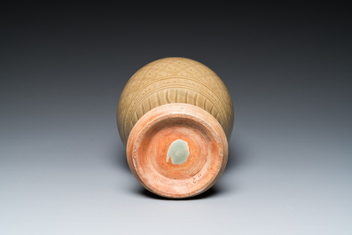 A Chinese Longquan celadon vase with underglaze design, Yuan or later