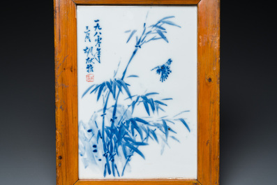 A Chinese grisaille 'landscape' plaque and a blue and white plaque signed Hu Xianya 胡献雅, 20th C.
