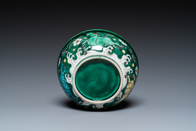A Chinese verte biscuit 'galloping horses' bowl, Qing