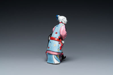 A Chinese famille rose 'ear cleaning' group, Qianlong