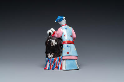 A Chinese famille rose 'ear cleaning' group, Qianlong