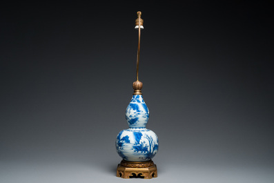 A Chinese blue and white double gourd vase mounted as a lamp, Transitional period