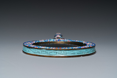 A Chinese Canton enamel hand mirror, inscribed 'Dan Na', Qianlong