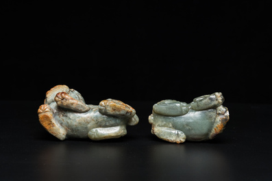 Two Chinese celadon and russet jade Buddhist lion sculptures, Qing
