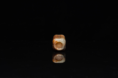 A Chinese celadon and russet jade 'cong' snuff bottle, probably Qing