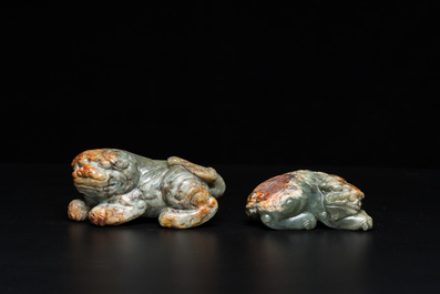 Two Chinese celadon and russet jade Buddhist lion sculptures, Qing