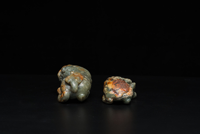 Two Chinese celadon and russet jade Buddhist lion sculptures, Qing
