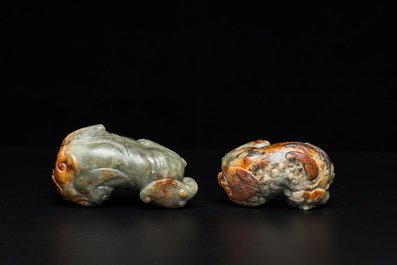 Two Chinese celadon and russet jade Buddhist lion sculptures, Qing
