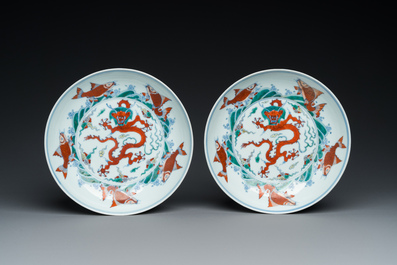 A pair of Chinese doucai 'dragon' plates, Chenghua mark, Kangxi