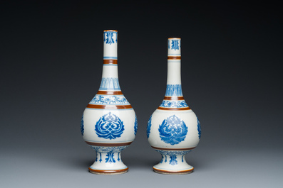 A pair of Chinese blue and white 'Baoxiang' sprinklers, Kangxi