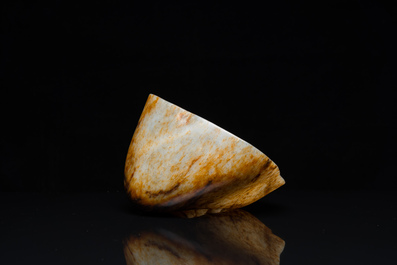 A Chinese hollowed jade libation cup on wooden stand, probably Qing