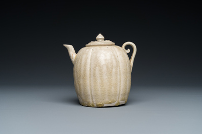 A Vietnamese beige-green-glazed melon-shaped ewer and cover, L&yacute;, 11/13th C.