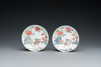 A pair of Chinese famille rose cups and saucers, Yongzheng