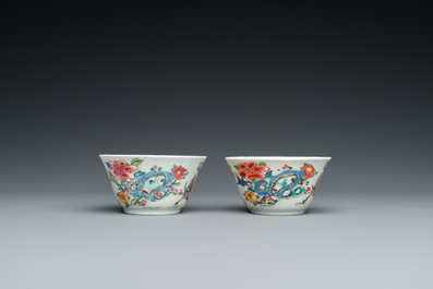 A pair of Chinese famille rose cups and saucers, Yongzheng