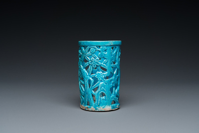 A Chinese reticulated monochrome turquoise brush pot on wooden stand, Qing