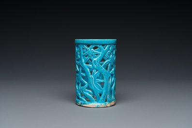 A Chinese reticulated monochrome turquoise brush pot on wooden stand, Qing