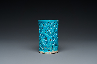 A Chinese reticulated monochrome turquoise brush pot on wooden stand, Qing