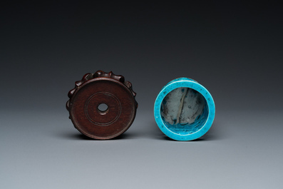 A Chinese reticulated monochrome turquoise brush pot on wooden stand, Qing