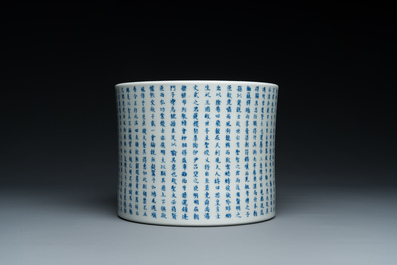 A Chinese blue, white and copper-red inscribed brush pot, Kangxi mark, 19/20th C.