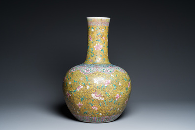 A large Chinese famille rose yellow-ground bottle vase, Qianlong mark, 19th C.