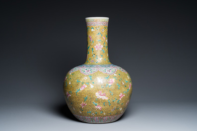 A large Chinese famille rose yellow-ground bottle vase, Qianlong mark, 19th C.