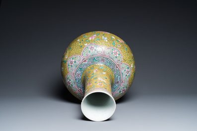 A large Chinese famille rose yellow-ground bottle vase, Qianlong mark, 19th C.