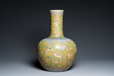 A large Chinese famille rose yellow-ground bottle vase, Qianlong mark, 19th C.