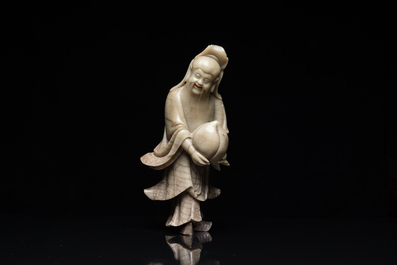 A Chinese soapstone Shou Lao on stand, Kangxi