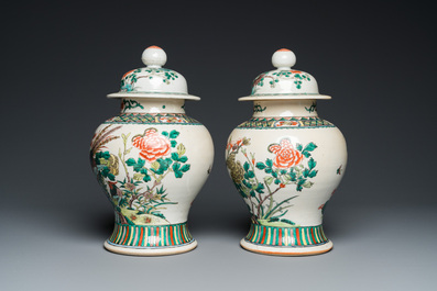 A pair of Chinese Nanking famille verte vases and covers, 19th C.