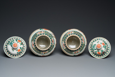 A pair of Chinese Nanking famille verte vases and covers, 19th C.