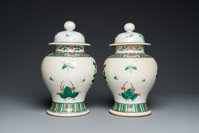 A pair of Chinese Nanking famille verte vases and covers, 19th C.