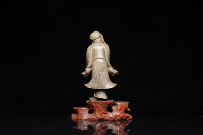 A Chinese soapstone Shou Lao on stand, Kangxi