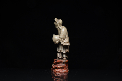 A Chinese soapstone Shou Lao on stand, Kangxi