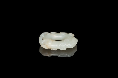 A Chinese 'twin chilong&rsquo; white jade circular pendant, Qing
