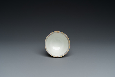 A Chinese famille rose 'erotical subject' cup and saucer, Yongzheng/Qianlong