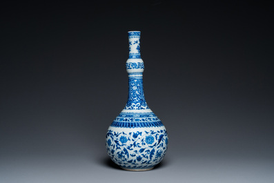 A Chinese blue and white bottle vase with floral design, Kangxi