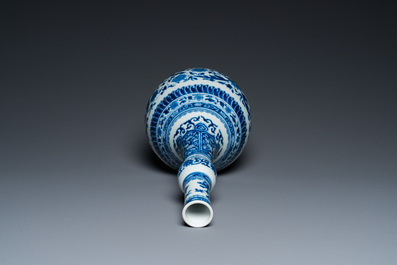 A Chinese blue and white bottle vase with floral design, Kangxi
