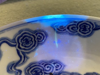 Two Chinese blue and white 'clouds' dishes and three plates, 19th C.