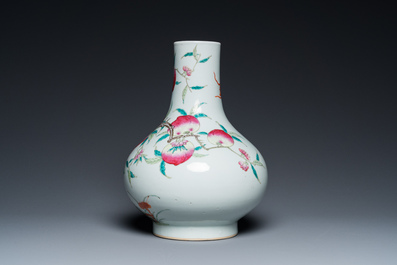 A Chinese famille rose 'nine peaches' bottle vase, 19th C.