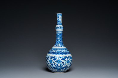 A Chinese blue and white bottle vase with floral design, Kangxi