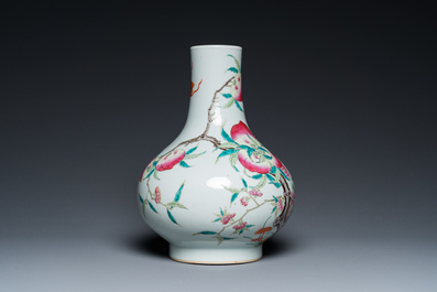 A Chinese famille rose 'nine peaches' bottle vase, 19th C.