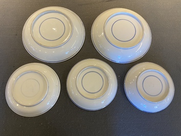 Two Chinese blue and white 'clouds' dishes and three plates, 19th C.