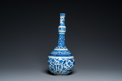 A Chinese blue and white bottle vase with floral design, Kangxi