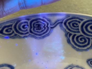 Two Chinese blue and white 'clouds' dishes and three plates, 19th C.