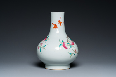 A Chinese famille rose 'nine peaches' bottle vase, 19th C.